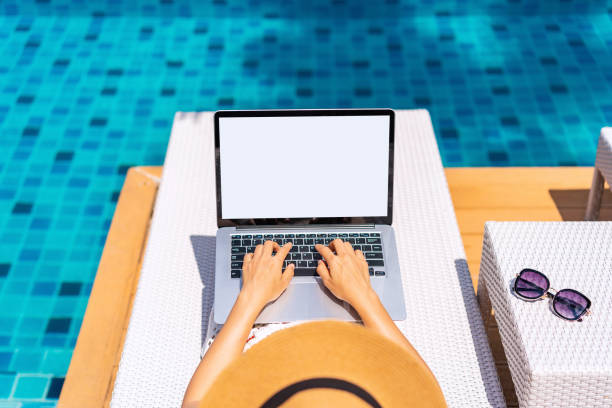 istock Young woman freelancer traveler working online using laptop while traveling on summer vacation, Freelance and workation concept 1403851166