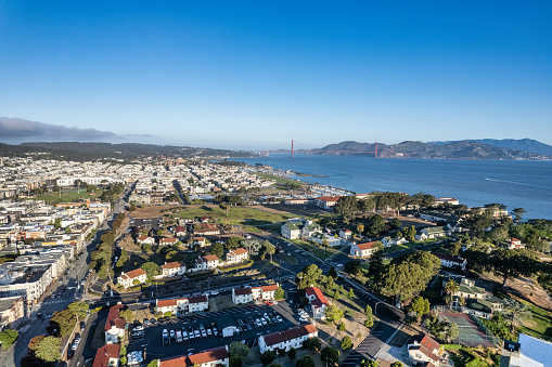 Aerial view of Fort Mason looking over the park and marina with the Golden Gate Bridge in the distance.
