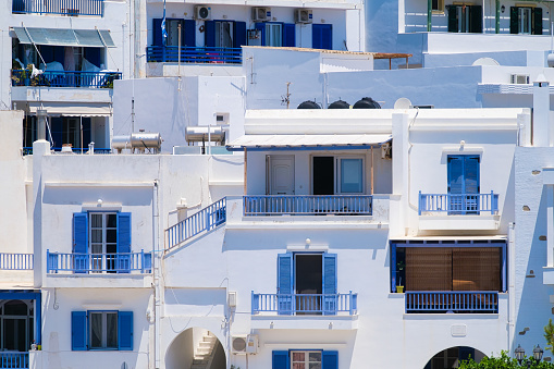 Houses and streets in Greek architecture. Photography for travel and adventure. Cascading arrangement of buildings on the hillside.