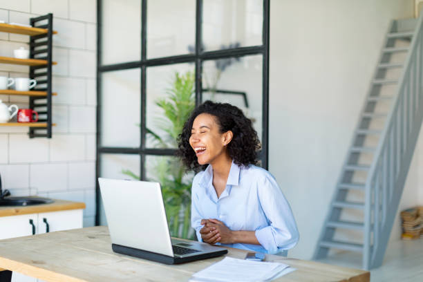 istock Young Black Woman Working From Home Using Laptop 1403851448