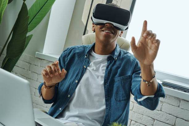 istock Joyful mixed race man wearing virtual reality glasses 1403852401