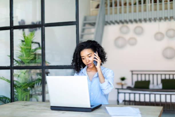 istock Young Black Woman Working From Home Using Laptop 1403852749