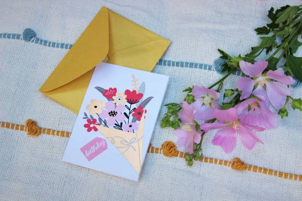 istock Birthday card and flowers 1403855357