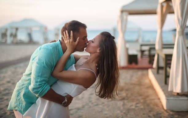 istock Romantic couple is kissing 1403858243