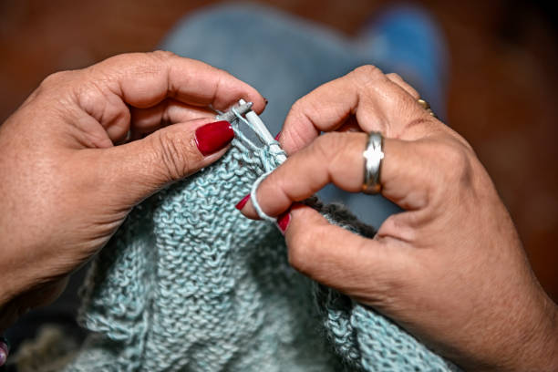 istock Hands of an older woman, working on crafts. 1403859247