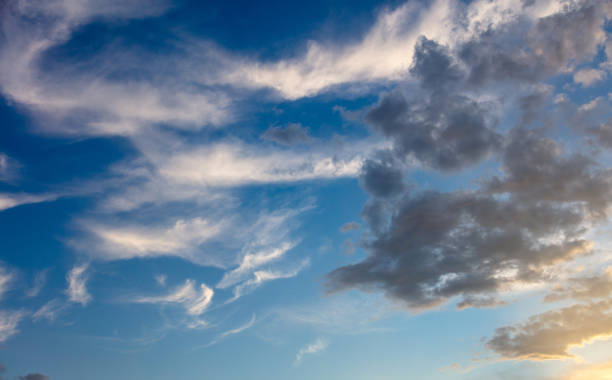istock Cloud on blue sky background. Cloudscape grey and orange shade. Twilight light color the cloudy sky 1403862418
