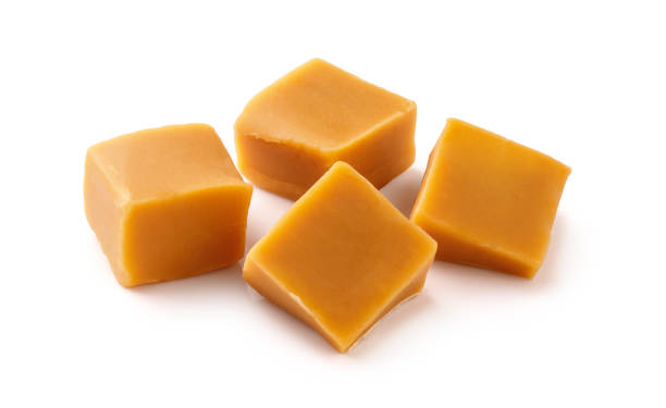 istock Caramel cubes isolated on white background. Caramel candy. 1403862543