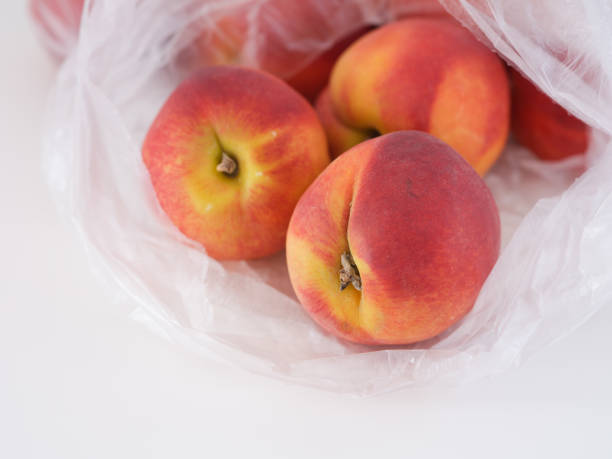 istock Freshly harvested peaches in a plastic bag 1403870182