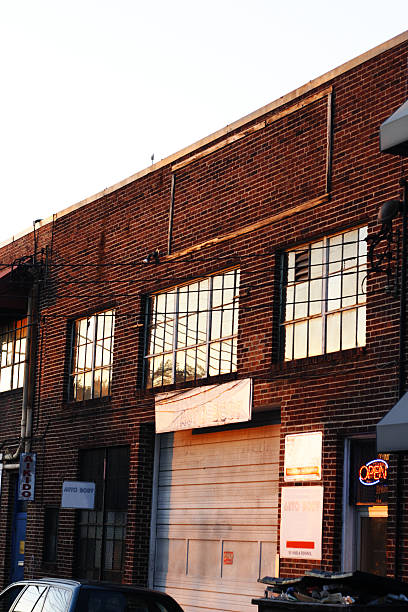 istock Old brick building with auto repair garage 140387104