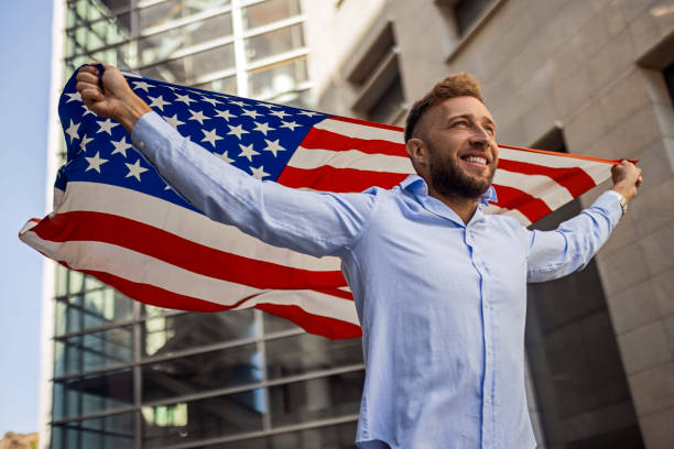 istock Young man posing with American flag 1403872174