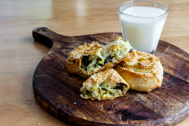 istock Baked twisted patties with dock and white cheese served for consumption 1403872312