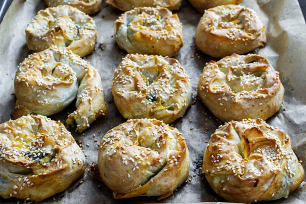istock Twisted patties with dock and white cheese placed in the pan 1403872401