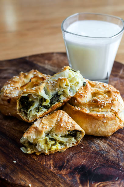 istock Baked twisted patties with dock and white cheese served for consumption 1403872472