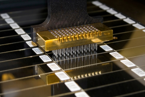 Close-up view of the head of a microarray printer. Microarrays are used in biomedical genomics research and contain thousands of molecular probes, most usually DNA, proteins or antibodies.