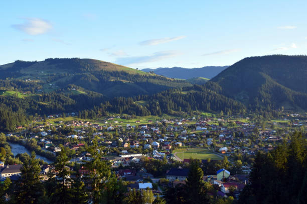 istock Small town in a picturesque summer valley between mountains 1403873172