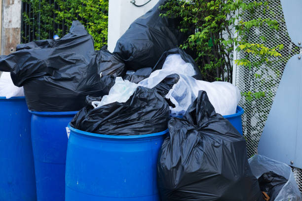 istock Over filled garbage bins with bags of waste 1403876448