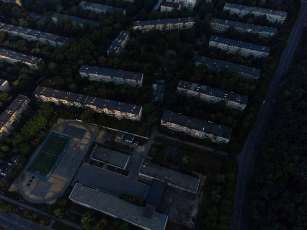 istock Aerial morning empty street, district and forest 1403878989