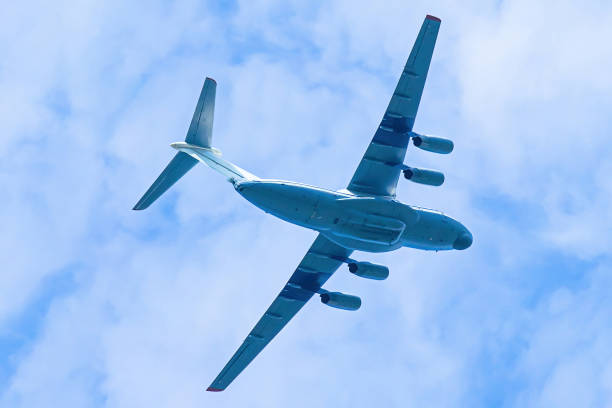 istock Airplane is flying in blue sky. Commercial passenger and cargo a 1403881366