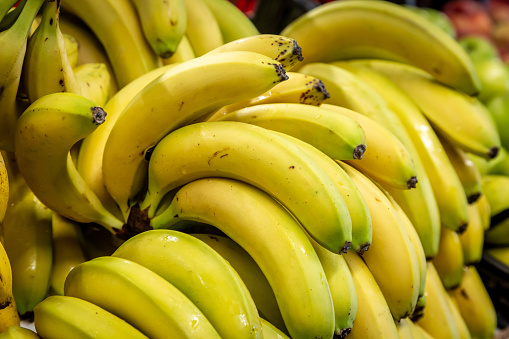 Bunches of bananas in a supermarket, with a shallow depth of field