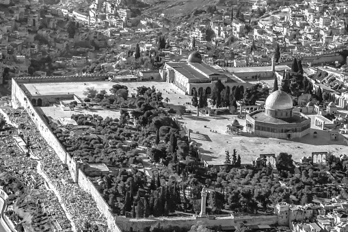 The Dome of the Rock is an Islamic shrine located on the Temple Mount in the Old City of Jerusalem. This view was taken from the tower of the Lutheran church with the mount of olives in the background