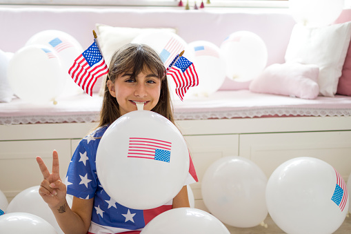 Cute girl with American Flag balloon