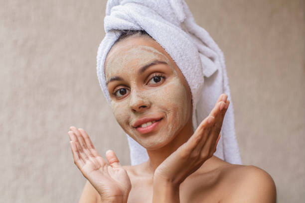 istock Happy woman in beauty mask 1403885577