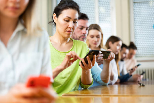 istock Portrait of students using mobile phones during lesson 1403886421