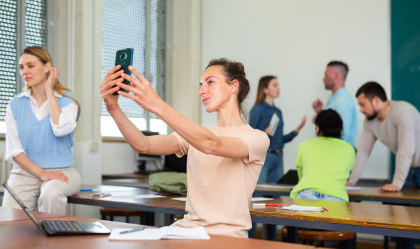istock Woman university student taking selfies during recess 1403886476