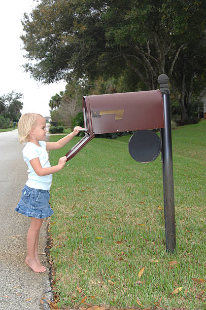 istock Little Girl Checking Mail 140388803