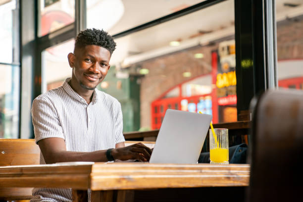istock Man working on laptop at cafe 1403891897