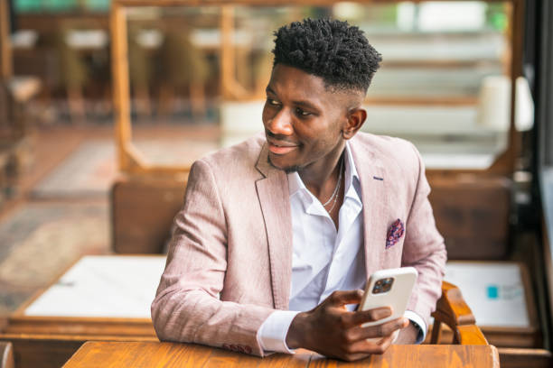 istock Ivorian businessman using smart phone 1403891917