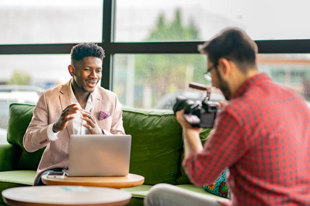 istock African vlogger video shooting with cameramen 1403892005