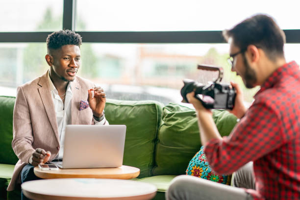 istock African vlogger video shooting with cameramen 1403892012