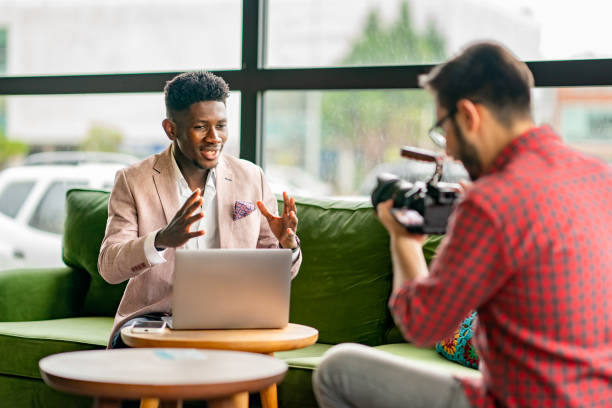 African vlogger video shooting with cameramen