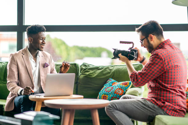 istock African vlogger video shooting with cameramen 1403892022