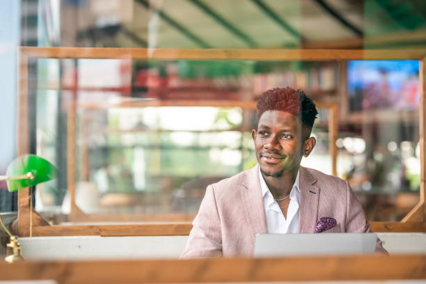 istock African Businessman working remote with portable devices 1403892045