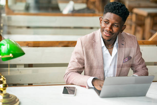 istock African Businessman working remote with portable devices 1403892067