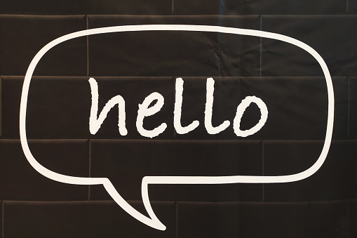Hello message with speech bubble on black background