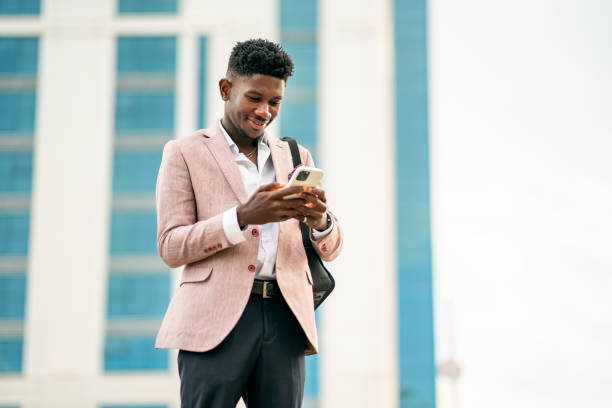 istock Ivory Cost Businessman using smart phone 1403893358
