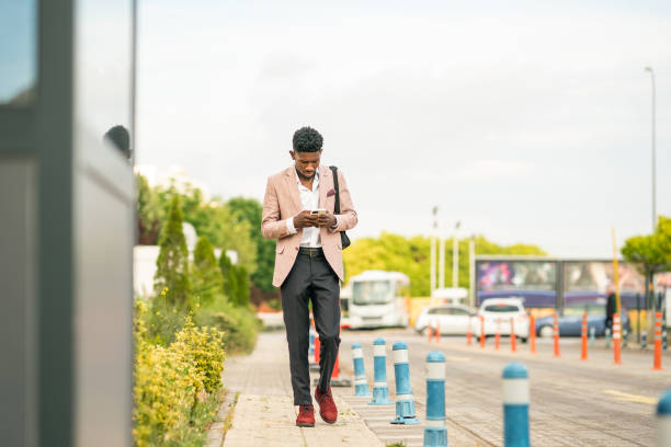 istock Ivory Cost Businessman using smart phone 1403893437