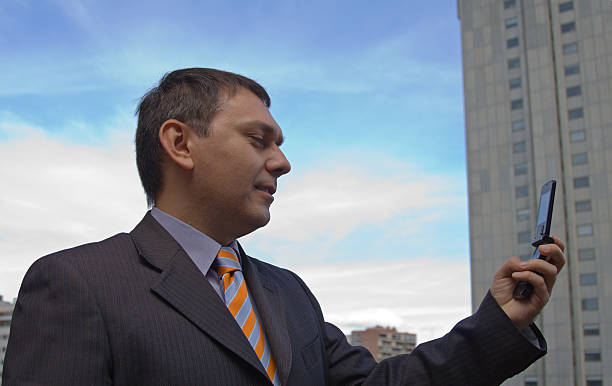 Businessman talking on Video Cell Phone