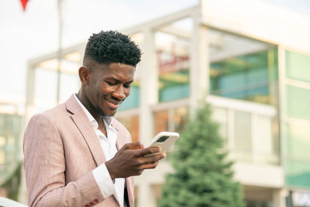istock Ivory Cost Businessman using smart phone 1403894085
