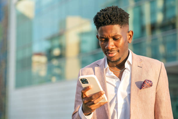 istock Ivory Cost Businessman using smart phone 1403894172