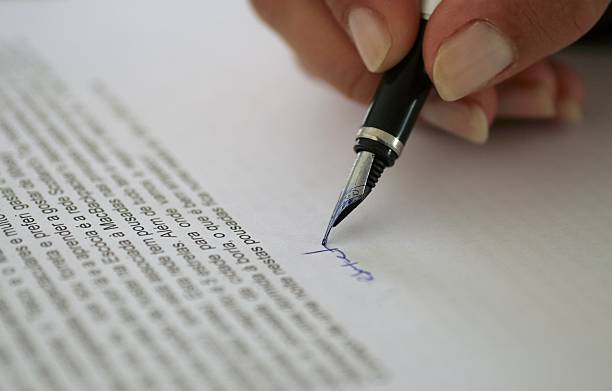 istock Woman Signing a Contract 140389642