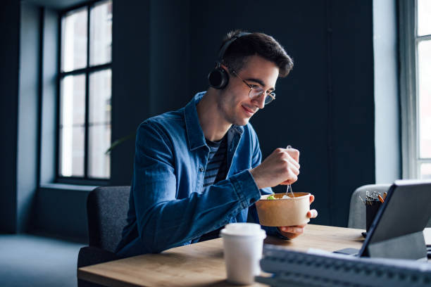 istock University Student Listening Online Lesson On His Digital Tablet While Having Lunch In The Library 1403897294