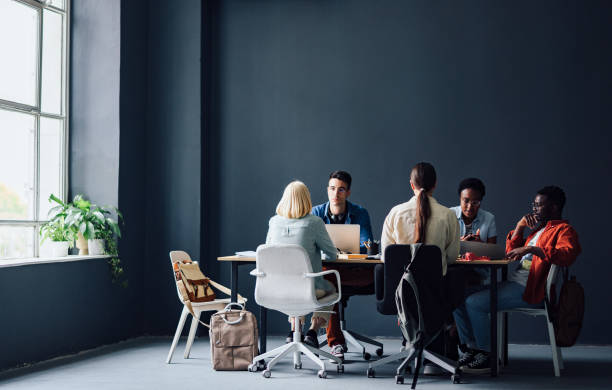 istock Five Friends Studying Together In The Library 1403897405