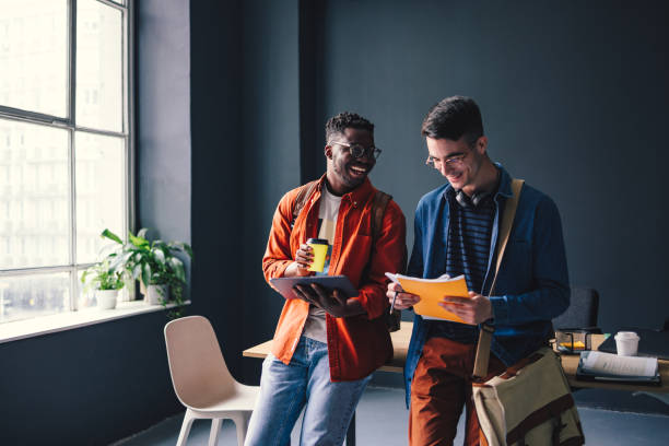 istock Two Happy Friends Talking In The Library 1403897487