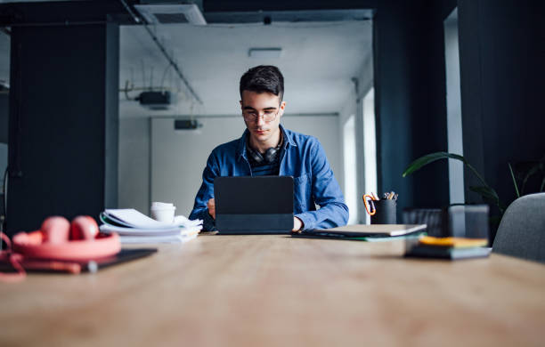 istock University Student Studying Online On His Digital Tablet In The Library 1403897498