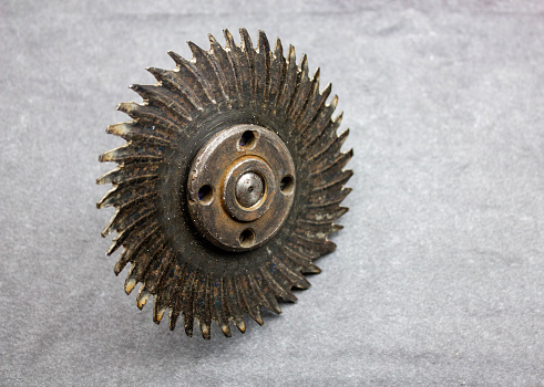 The Metal disc with teeth. Carving disc industrial construction tool for construction site.