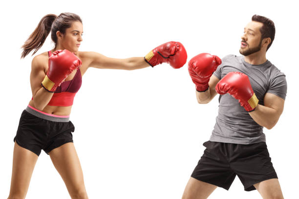 istock Woman punching a man with boxing gloves 1403899268